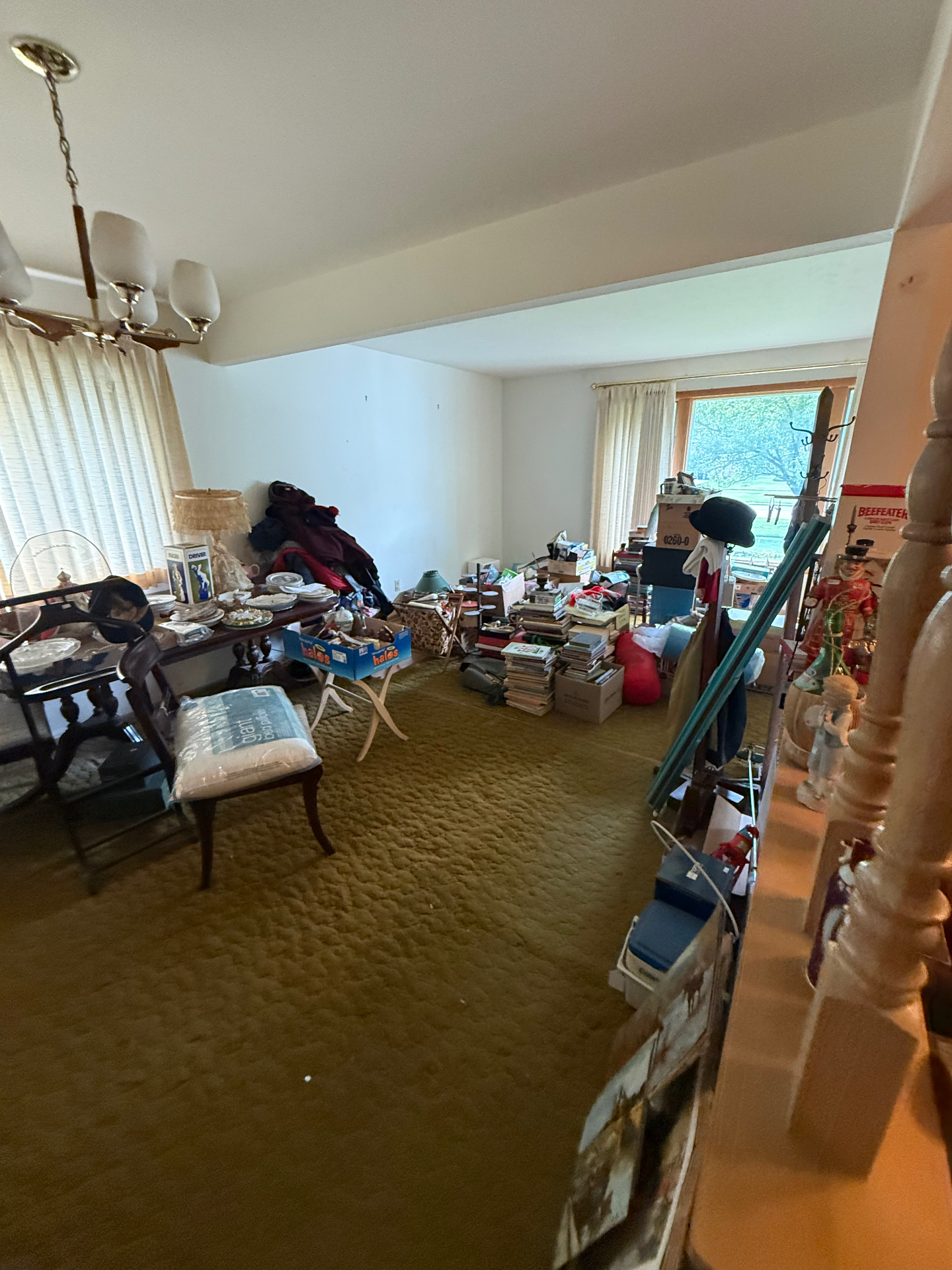 Cluttered estate home interior with furniture, boxes, and belongings awaiting full cleanout by The Best Junk Removal